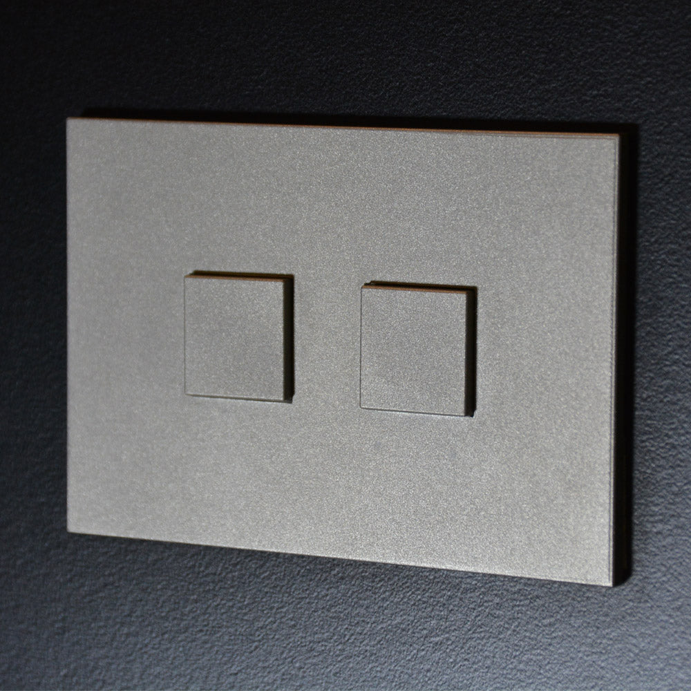 Interrupteur Mantagua 2 poussoirs en inox brossé rectangulaire, dimensions 92x62x13 mm.